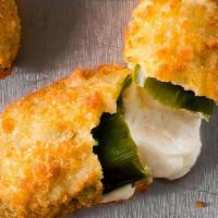 Jalapeno Poppers · Mild jalapeño pepper halves stuffed with rich cream cheese coated in a light, crispy breading.