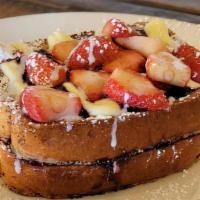 Stuffed Brioche French Toast · Two pieces, filled and topped with homemade creme fraiche, topped with fresh strawberries or...