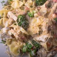 Grilled Chicken Bowtie · Grilled chicken breast tossed with bowtie pasta, broccoli and tomatoes in our homemade mushr...