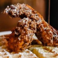 Chicken And Waffle · Belgium Style Waffle Topped W/ Two Chicken Tenders. 