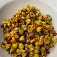 Southwest Corn · Fresh corn straight off the cob and sauteed with peppers and fresh herbs