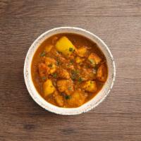 Chicken Vindaloo · Boneless chicken and potatoes cooked in a spicy hot curry.