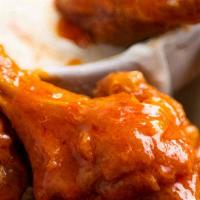 Back Alley Wing Basket - · 8 wingettes cooked crisp and tossed in our secret buffalo sauce or bar-B-Q sauce or no sauce...