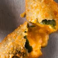 Jalapeno Popper - · 4 Cheddar Chez filled Jalapeno poppers, cooked to golden brown.  Cheesy with zest!