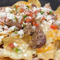 Pulled Pork Nachos · Pulled Pork Nacho's
Topped with queso and fresh pico de gallo