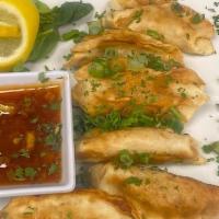 Chicken Pot Stickers · 6 tender pot stickers tossed in a sweet red chili sauce