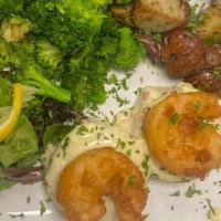 Baltimore Maryland Style Crab Cakes And Shrimp · Two crab cakes topped with jumbo shrimp in a white wine butter sauce roasted redskin potatoe...