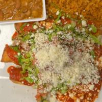 Chicken Flautas Dinner · Crispy chicken flautas topped with a guajillo sauce, shredded lettuce, pico de gallo and que...