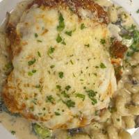 Chicken Parmesan  · Hand breaded chicken topped with marinara, parmesan and melted mozzarella over cavatappi pas...
