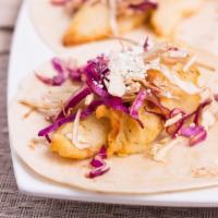 Blackened Catfish Tacos · Two tortillas with blackened catfish, lettuce, tomatoes, sprinkled with cotija cheese. Serve...