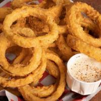 Skinny Boy Onion Rings · Large, thin slices of onion, battered and deep fried.  Served with Ranch.