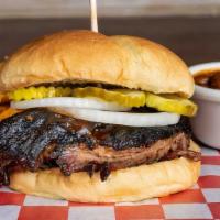 Prime Brisket Sliced Sandwich · Served on a toasted bun with onions, pickles and BBQ sauce.  Choose two made from scratch si...
