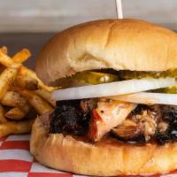 Pulled Pork Sandwich · Served on a toasted bun with onions, pickles and 
