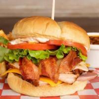 The Country Club · Peppered turkey,  bacon, jack cheese, cheddar, lettuce, tomato and onion served with club ma...
