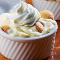 Banana Pudding · It's cool, rich & creamy.  Vanilla pudding, sliced bananas & vanilla wafers - topped with re...