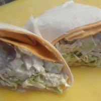 Chicken Wraps · Chicken, celery, grapes, onions, walnuts, mayo on a bed of cabbage with Caesar dressing on a...