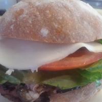 Roast Beef Deli · Roast beef, Provolone cheese, lettuce, tomato on Grand Central Bakery Rustic roll.  Mayo and...