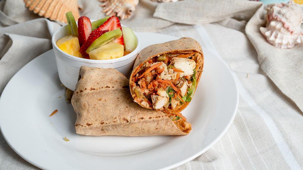 Chicken Salad Wrap · Chicken salad with lettuce, tomato and mayo in a spinach tortilla. Served with fresh fruit.