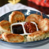 Chicken Dumplings (6) · Fried or steamed – a delightful combination of chicken, cabbage, ginger, scallions with a hi...
