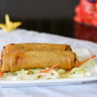Veggie Spring Rolls (2) · Crispy spring rolls filled with cabbage, carrots, and celery, seasoned to perfection.