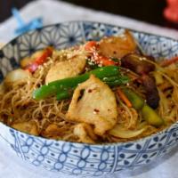 Singapore Rice Noodles · Spicy, gluten free. Thin rice vermicelli wok tossed in a spicy aromatic curry seasoning alon...