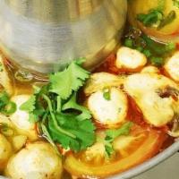 Tom Yum · Soft tofu, tomatoes, mushrooms, onions, scallions, cilantro in Tom Yum Paste, lime juice fla...