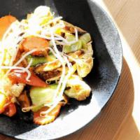 Phad Woon Sen · Bean thread noodles, fried tofu, tomatoes, shiitake mushrooms, celery, onions, carrots, caul...