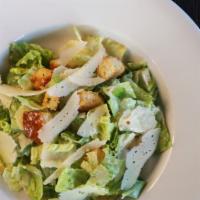 Classic Caesar Salad · Freshly torn romaine lettuce tossed with garlic croutons, parmesan cheese with a traditional...
