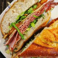 Italian Sandwich · Sliced ham, salami, and pepperoni, sliced provolone topped with shredded lettuce, red onion,...