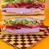 Roasted Turkey Club · on Texas toast w/ shredded iceberg, bacon, tomato, and Duke’s mayo