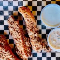 Buttermilk Fried Chicken Strips · Three boneless breast strips with ranch and remoulade sauces