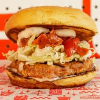 Ballard Salmon Burger · House-made smoked salmon burger, tartar sauce, cabbage slaw, Mama Lil’s Peppers and mayo
