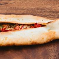 Vegan Pide · Turkish flatbread stuffed with a house-made vegan garlic lemon 'ricotta' and tomatoes