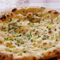 Onion Naan · Oven-baked flatbread topped with onion.