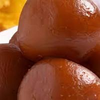 Gulub Jaman · Fried dough ball in a sweet syrup of honey and rosewater.