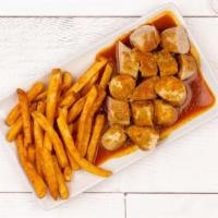Curry Wurst · Our delicious Bratwurst is seared to perfection, sliced, covered with our traditional curry ...