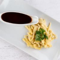 Spaetzle With Gravy · Our favorite traditional side dish to a perfect Schnitzel. Handmade in our kitchen from scra...