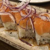 Salmon Lover · Salmon, avocado topped with salmon, Japanese spices ponzu sauce, sesame oil and onions. *Tho...