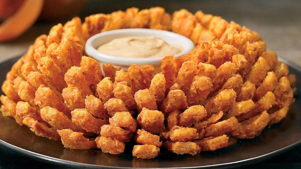 Bloomin' Onion® · An Outback Original! Our special onion is hand-carved, cooked until golden and ready to dip into our spicy signature bloom sauce.