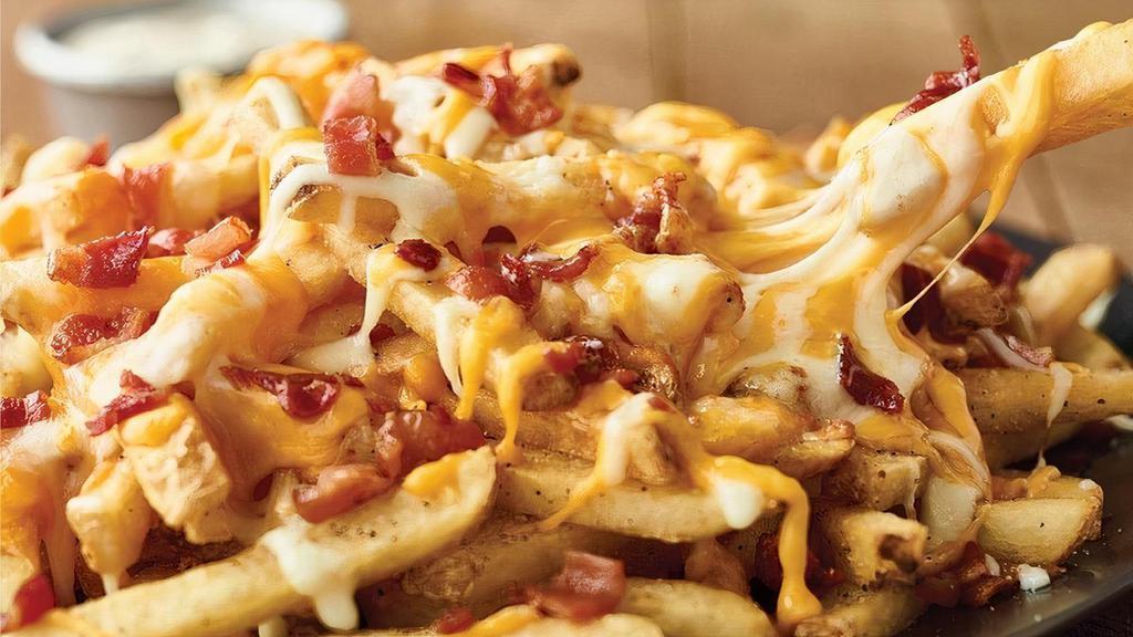 Aussie Cheese Fries · Topped with melted Monterey Jack, Cheddar and chopped bacon with house-made ranch dressing.