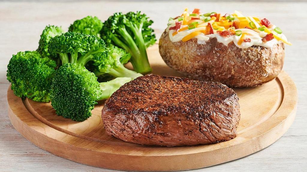 Outback Center-Cut Sirloin* · Center-cut for tenderness. Lean, hearty and full of flavor. Seasoned and seared. Served with two freshly made sides.