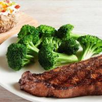 Bone-In New York Strip* 16 Oz. · Thick cut, bone-in and full of rich flavor. Served with two freshly made sides.