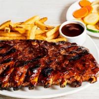 Outback Ribs  · Smoked, brushed & grilled with a tangy BBQ sauce. Served with two freshly made sides.