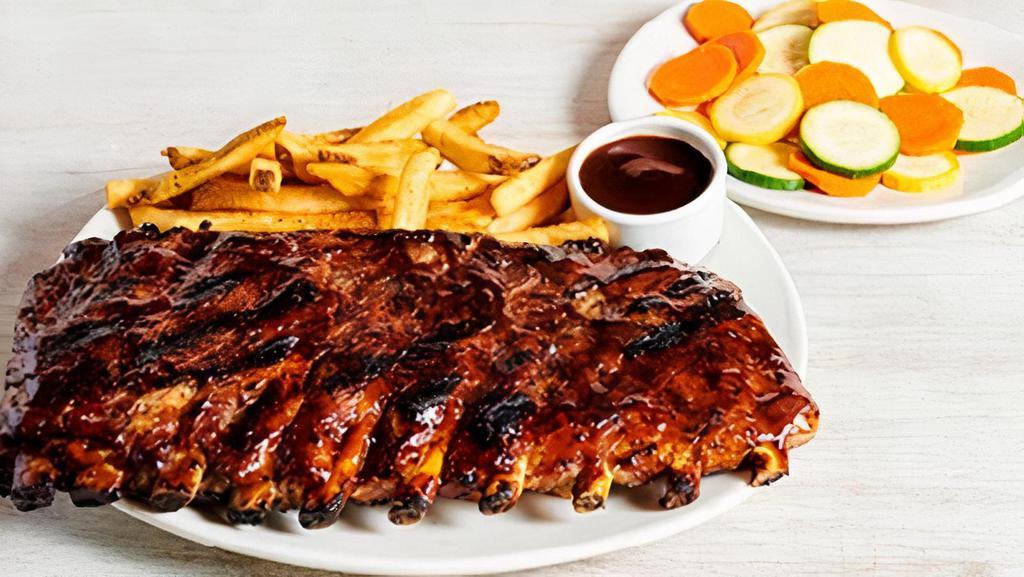Baby Back Ribs · Smoked, grilled and brushed with a tangy BBQ sauce. Served with two freshly made sides.