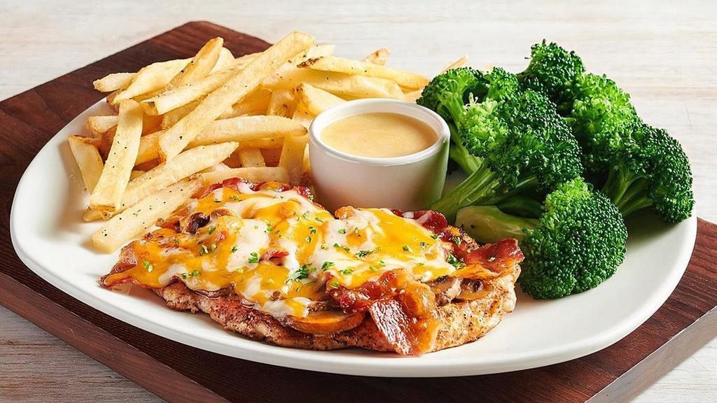 Alice Springs Chicken® · Grilled chicken breast topped with sautéed mushrooms, crisp bacon, melted Monterey Jack and Cheddar and honey mustard sauce. Served with two freshly made sides.