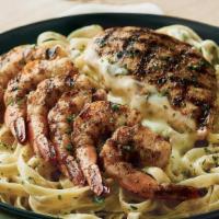 Queensland Chicken & Shrimp Pasta · Grilled chicken and shrimp and fettuccine noodles tossed in a bold Alfredo sauce