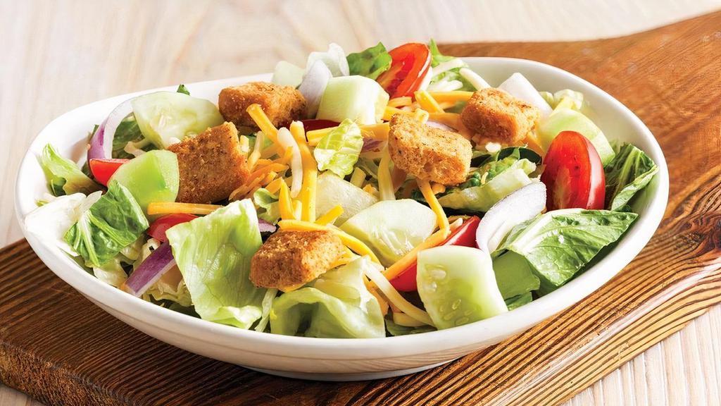House Side Salad · Fresh mixed greens, dressing of choice, cucumbers, Monterey Jack and Cheddar cheese, tomatoes, red onions and homemade croutons