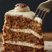 Triple-Layer Carrot Cake** · Moist layers of carrot cake with coconut and pecans topped with a sweet vanilla cream cheese...