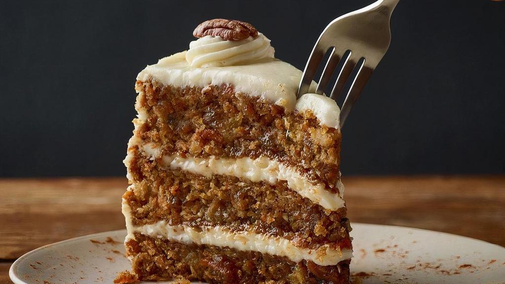 Triple-Layer Carrot Cake** · Moist layers of carrot cake with coconut and pecans topped with a sweet vanilla cream cheese icing.