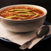 Tortilla Soup · Pieces of grilled chicken breast, with tortilla strips in a rich chicken broth, topped with ...